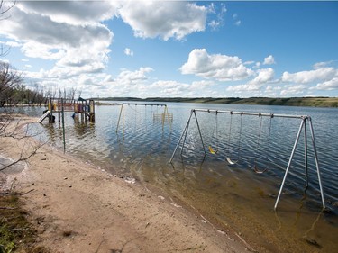 A playground structure sits underwater in Manitou Beach, SK on Friday, August 5, 2016.