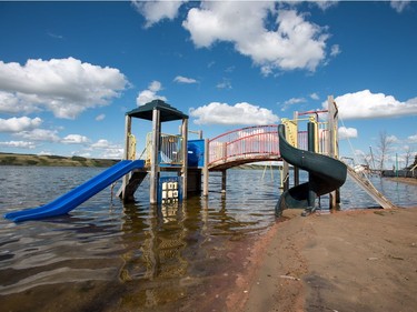 A playground structure sits underwater in Manitou Beach, SK on Friday, August 5, 2016.