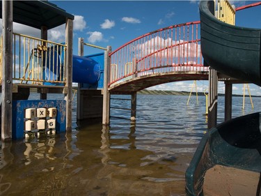 A playground structure sits underwater in Manitou Beach, SK on Friday, August 5, 2016.