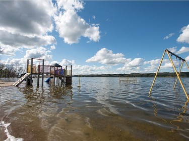 A playground structure sits underwater in Manitou Beach, SK on Friday, August 5, 2016.