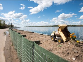 A retaining wall holds water back from running on to the roads in Manitou Beach, SK on Friday, August 5, 2016.