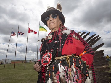 Dancers, dignitaries and delegates, like Denny Morrison of Chachachas First Nation, participate in the Grand Entry for Wanuskewin Days Cultural Celebration and Powwow, August 23, 2016, in conjunction with the World Indigenous Business Forum at Wanuskewin Heritage Park.
