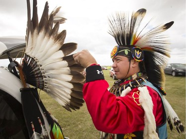 Dancers, dignitaries and delegates, like Adrian Klein of Saskatoon, participate in the Grand Entry for Wanuskewin Days Cultural Celebration and Powwow, August 23, 2016, in conjunction with the World Indigenous Business Forum at Wanuskewin Heritage Park.