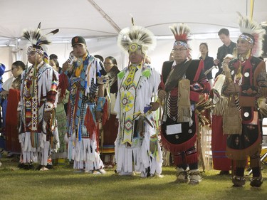 Dancers, dignitaries and delegates participate in the Grand Entry for Wanuskewin Days Cultural Celebration and Powwow, August 23, 2016, in conjunction with the World Indigenous Business Forum at Wanuskewin Heritage Park.