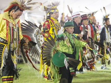 Dancers, dignitaries and delegates participate in the Grand Entry for Wanuskewin Days Cultural Celebration and Powwow, August 23, 2016, in conjunction with the World Indigenous Business Forum at Wanuskewin Heritage Park.