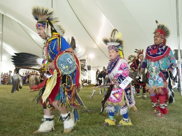 Dancers, dignitaries and delegates young and old participate in the Grand Entry for Wanuskewin Days Cultural Celebration and Powwow, August 23, 2016, in conjunction with the World Indigenous Business Forum at Wanuskewin Heritage Park.