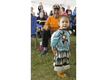 Dancers, dignitaries and delegates, like one-year-old Kenna Kaiswatum, were at the Grand Entry for Wanuskewin Days Cultural Celebration and Powwow, August 23, 2016, in conjunction with the World Indigenous Business Forum at Wanuskewin Heritage Park.