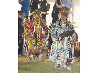 Dancers, dignitaries and delegates participate in the Grand Entry for Wanuskewin Days Cultural Celebration and Powwow, August 23, 2016, in conjunction with the World Indigenous Business Forum at Wanuskewin Heritage Park.