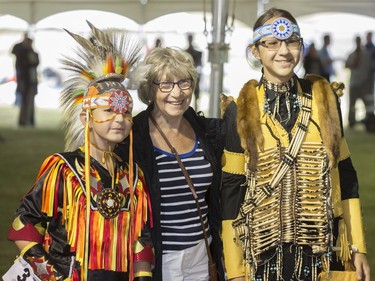 Traditional dancers pose for photos before participating in the Grand Entry for Wanuskewin Days Cultural Celebration and Powwow, August 23, 2016, in conjunction with the World Indigenous Business Forum at Wanuskewin Heritage Park.