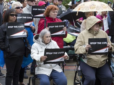 People attend a rally/protest at City Hall and listen to Leader of the Official Opposition Trent Wotherspoon speak about announced Sask. Party cuts to income assistance for the province's most vulnerable, August 26, 2016.