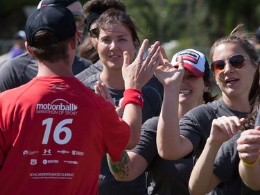 Participants high five one another following a game of soccer at Motionball Marathon of Sport Saskatoon at Aden Bowman in Saskatoon, SK on Saturday, August 27, 2016.