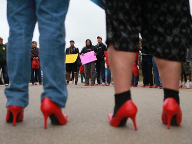 Several police officers and other men wore red high heels during the annual Walk for Missing and Murdered Indigenous women at Ahtahkakoop First Nation on Aug. 23, 2016.