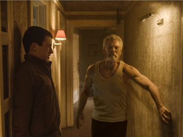 Dylan Minnette (L) and Stephen Lang star in "Don't Breathe."