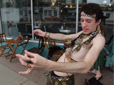 Twenty-one-year-old Jace Adamson, executes a complicated belly-dancing move outside of the Broadway Café before a belly-dancing performance by the Oriental Dance Arts of Saskatoon as part of the PotashCorp Fringe Festival on Thursday evening. He hopes to inspire other men to take up the dance form, which he said is both complex and relaxing at the same time.