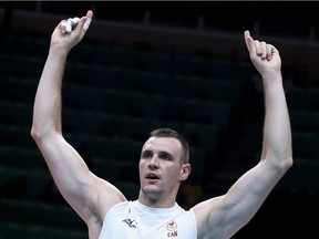 Gavin Schmitt of Canada celebrates the victory against the United States during the Men's Preliminary Pool A match between the United States and Canada on Day 2 of the Rio de Janeiro Olympic Games at Maracanzinho on August 7, 2016 in Rio de Janeiro, Brazil.