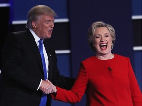 HEMPSTEAD, NY - SEPTEMBER 26:  (L-R) Republican presidential nominee Donald Trump and Democratic presidential nominee Hillary Clinton shake hands after the Presidential Debate at Hofstra University on September 26, 2016 in Hempstead, New York.  The first of four debates for the 2016 Election, three Presidential and one Vice Presidential, is moderated by NBC's Lester Holt.  (Photo by Spencer Platt/Getty Images) ORG XMIT: 671024373 ORG XMIT: POS1609262203162556