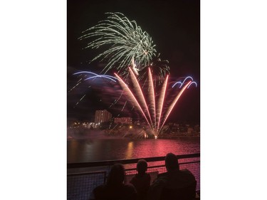 Spectators watch fireworks at the PotashCorp Fireworks Festival at River Landing in Saskatoon, September 3, 2016.