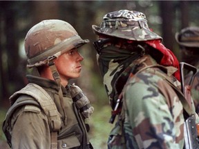 This iconic image from the 1990 Oka Crisis depicting Canadian soldier Patrick Cloutier and Brad Laroque alias "Freddy Kruger" is part of an international photo exibit.