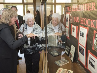 Cathy Howe, daughter of of Gordie Howe (L) and Gordie Howe's sister Helen Howe look over a display highlighting Gordie Howe at King George School, the elementary school Howe attended, in Saskatoon, September 25, 2016.