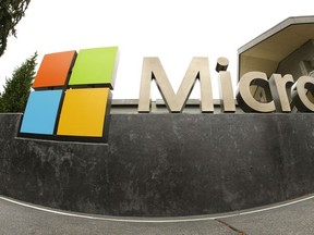 This July 3, 2014, file photo, shows the Microsoft Corp. logo outside the Microsoft Visitor Center in Redmond, Wash.
