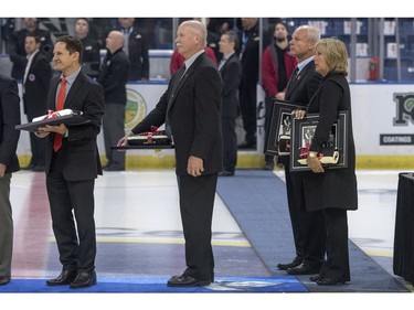 Gordie Howe's sons Murray Howe, left to right, Marty Howe, Mark Howe, and daughter Cathy Howe stand for the national anthem following speeches as part of Thank You, Mr. Hockey Day in Saskatoon at Sasktel Centre in Saskatoon, Sunday, September 25, 2016. Howe's remains where interred at a statue of him outside of the arena earlier today.