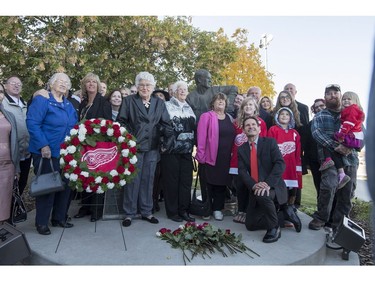 Members of Gordie Howe's family stand for a photograph following the internment of Gordie Howe's remains at the base of a statue of him during a memorial service outside Sasktel Centre in Saskatoon, Sunday, September 25, 2016.