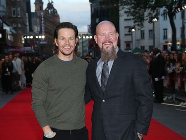 Actor Mark Wahlberg (L) and oil rig manager Mike Williams, who Wahlberg protrays, pose for photographers upon arrival at the premiere of "Deepwater Horizon" in London, England, September 26, 2016.