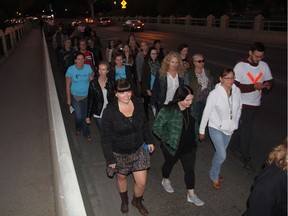 More than 200 people taking part in the annual Take Back the Night event marched through downtown Saskatoon and across the University Bridge on Thursday Night. Organizers with the Saskatoon Women's Community Coalition say the rally, at which people in the crowd yelled "claim our bodies, claim our right! Take a stand, take back the night," was aimed at raising awareness about domestic violence and interpersonal violence while reclaiming spaces where women, members of the LGBTQ community and all people may feel unsafe.