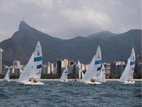 A view of the 3-Person Keelboat (Sonar) Sailing race with the Corcovado Mountain and Christ the Redeemer in the background at Marina da Glória. The Paralympic Games, Rio de Janeiro, Brazil, Saturday 17th September 2016.