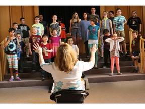 Kids of Note rehearse with musical director Brenda Baker. File photo