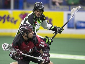 Chris Corbeil #16 of Saskatchewan Rush puts pressure on Jeremy Noble, #35 of Colorado Mammoth in NLL action on Saturday, April 16th, 2016.