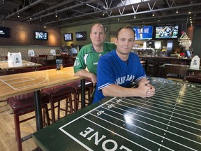 Daniel Ford Beavis, left, and his brother Jay in the League Sports Lounge, their newest downtown business.