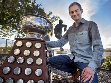 Corey Howe, grandson of the late Gordie's Howe with his statue and the NHL's Art Ross trophy at SaskTel Centre in Saskatoon where the WHL's Saskatoon Blades will pay tribute to Mr. Hockey during the season opener this weekend, September 21, 2016. Howe's name can be found six times on the trophy as the leagues leading scorer.