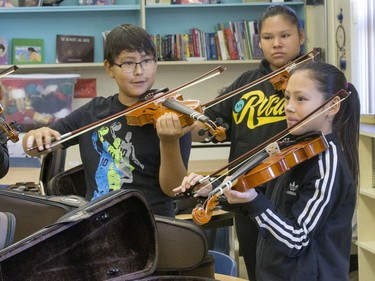 These St. Michael Community School students are eager to learn to play the fiddle in the school's new program that was gifted with 25 new instruments by master fiddler Natalie MacMaster, September 27, 2016.