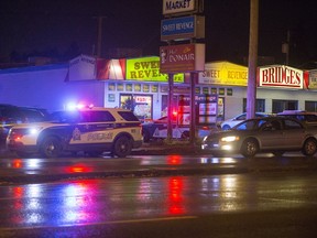 Police cruisers can be seen in the 2100 block of 22nd St. W. where a man was reported to have been stabbed in the neck at roughly 6:55 p.m. on September 28, 2016.