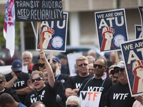 A crowd cheers during a speech at an a awareness rally for the ATU 615 held at City Hall in Saskatoon on Sept. 10, 2016.