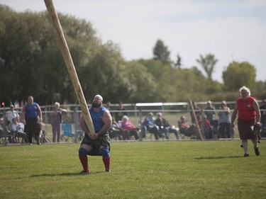 A man performs the Caber toss during the Heavy Event competition during the Saskatoon Highland Games in Saskatoon, September 10, 2016.