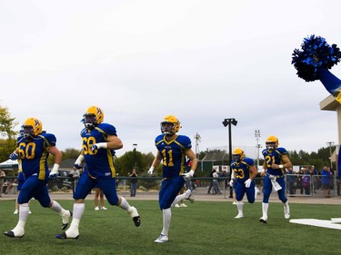 The Saskatoon Hilltops rush the field before playing the Regina Thunder at SMF field in Saskatoon, September 10, 2016.