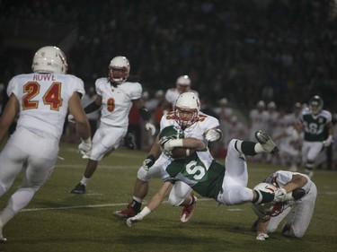 A U of S Huskies player gets tackled during play against the Calgary Dinos at Griffiths Stadium in Saskatoon, September 16, 2016.