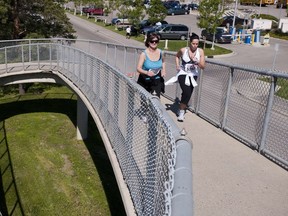 Saskatoon, SK. June 13th, 2010 Runners cross the pedestrian overpass near Potash Corp Stadium during the Bridge City Boogie in Saskatoon, SK.  Photo Liam Richards