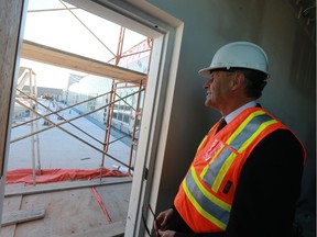 Education Minister Don Morgan checks out the outdoor learning space during a tour of the Stonebridge School site in Saskatoon on September 13, 2016.