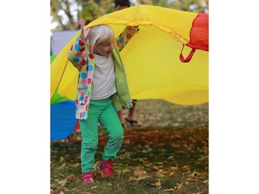 Julie Kurpjuweit plays with a parachute at the Word on the Street festival in Saskatoon on September 18, 2016 .