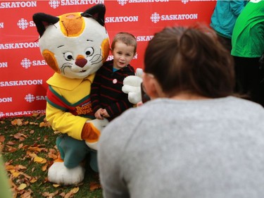 Oliver Ledingham-Off meets the Huckle Cat from the busy world of Richard Scarry at the Word on the Street festival in Saskatoon on September 18, 2016 .