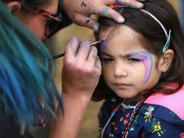Roenac Lothian gets her face painted at the Word on the Street festival in Saskatoon on September 18, 2016 .