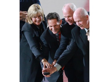 Gordie Howe's children pose for the puck drop during the pre-game ceremony at SaskTel Centre during Thank You, Mr. Hockey Day in Saskatoon on September 25, 2016.