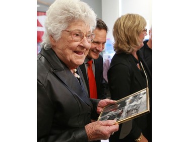 Gordie Howe's sister Viola Watson gets a smile out of a photo of Howe as a child in King George school, where he attended school in Saskatoon on September 25, 2016.