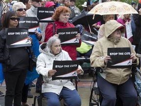 People in Saskatoon protest government cuts to income assistance for disabled people.