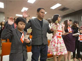 Seventy-Five people living in Saskatchewan were sworn in as Canadians in a citizenship ceremony on February 11, 2016. Abcde Briones, left to right, dad Jayson Briones, daughter Julia Briones and Anna Lee Briones. Immigration was the cause of nearly all of the 1.6 per cent surge to Saskatchewan's population from July 1, 2015, to June 30, 2016.