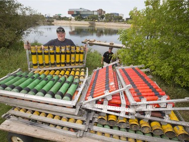 Brad Dezotell, owner of Fireworks Spectaculars, loads fireworks to a river barge at Rotary Park, September 1, 2016, in preparation for the PotashCorp Fireworks Festival, which kicks off Friday evening. Garden City Display Fireworks staff were also loading on the barge.