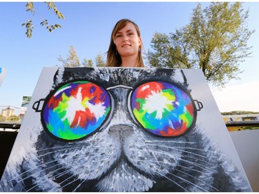 Artist Selena Daniel with one of her creations on display at River Landing during the PotashCorp Fireworks Festival, September 2, 2016.